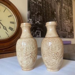 Pair of beige ceramic 9” chinoiserie vases with raised nature scene
